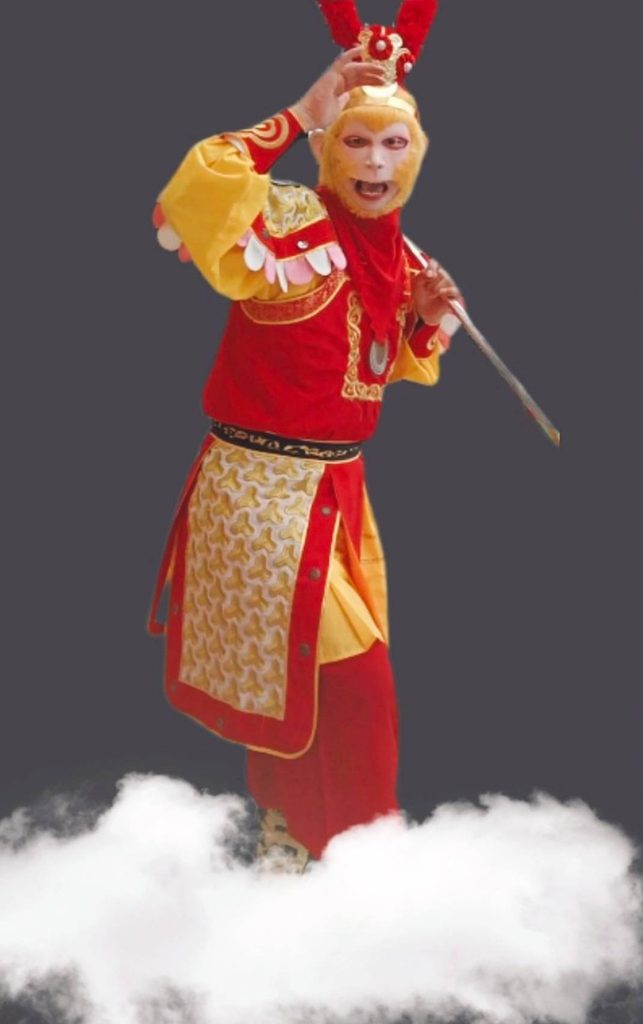 Monkey King 美猴王 performer in full Peking opera costume and face paint.