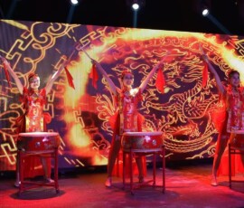 Chinese drum performance against a golden dragon backdrop at Velaa Private Island, Maldives